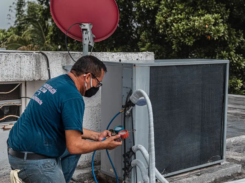 Contractor checking equipment on a job site