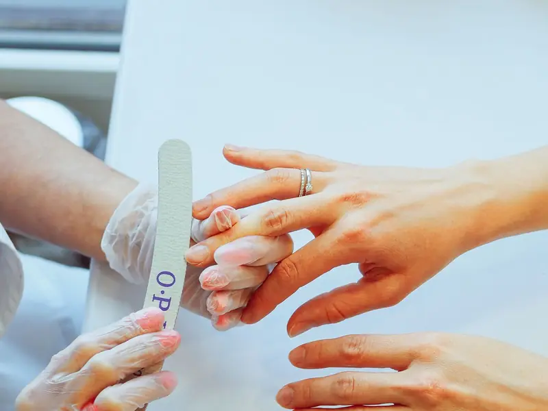 Nail technician giving a manicure